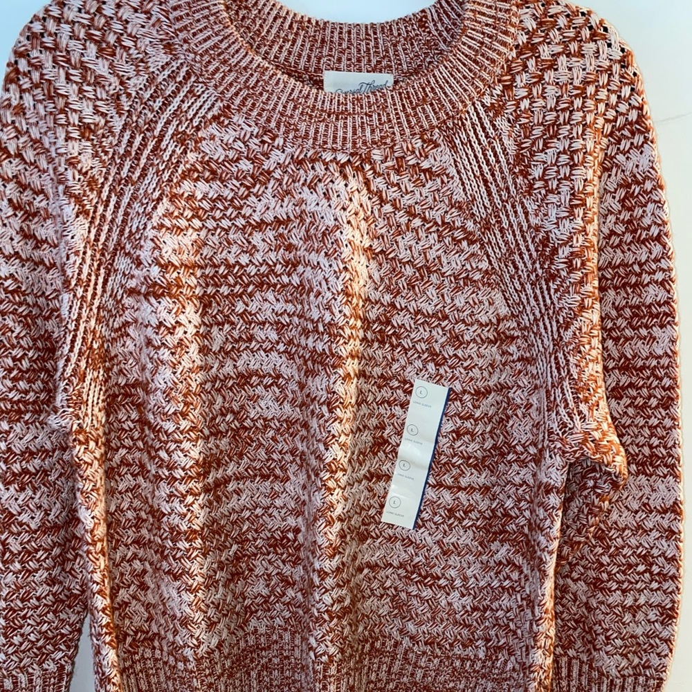Blended red and pink knit sweater